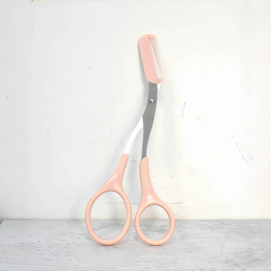 Pink eyebrow trimming scissors with built-in comb